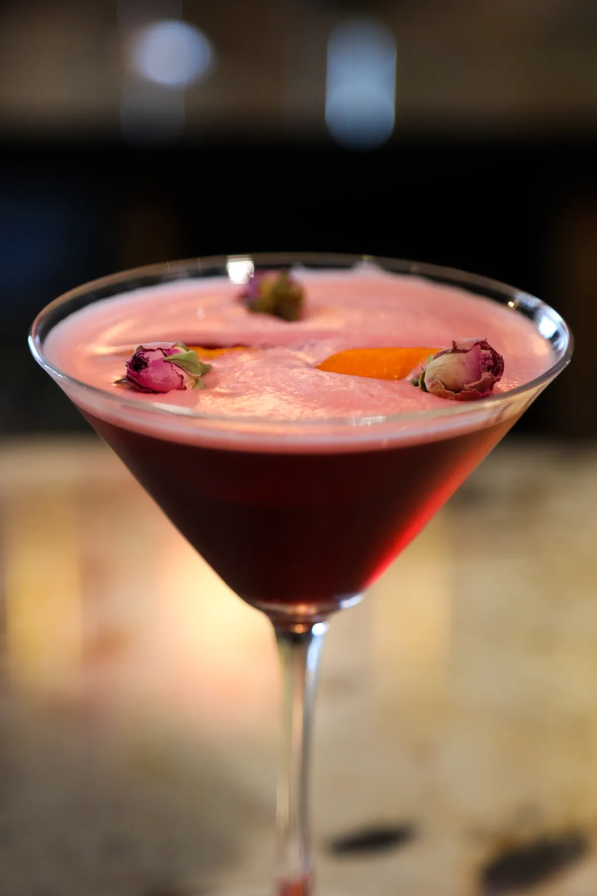 Signature cocktail with rose buds